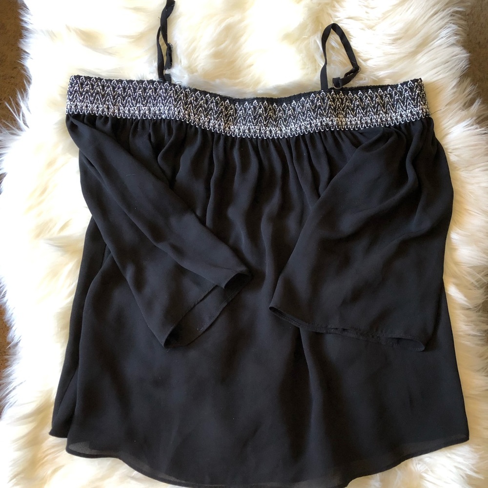 Black blouse. Elastic top w/ straps, flowy sleeves